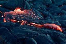 Vorschaubild A mesmerizing view of flowing lava on a volcanic landscape, capturing the intense heat and …
